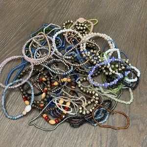 A bunch of beaded bracelets